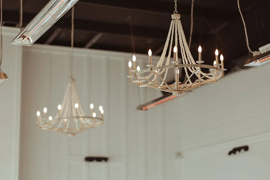 STRIVE Studio yoga and pilates room with chandeliers and natural light